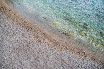 Soft blue ocean wave on clean sandy, a Nature Photo by HalfPoint