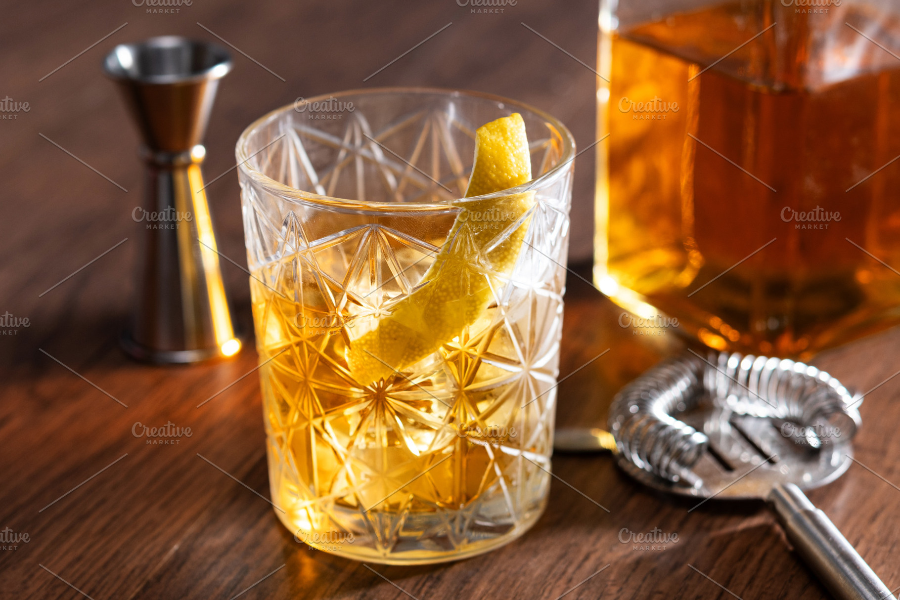 Rusty Nail Cocktail with Lemon Peel in Crystal Glass, a Food & Drink Photo by etorres69