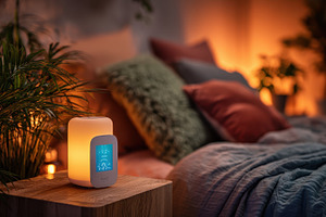 Smart bedside lamp illuminates cozy, a Photo by Pixeness Studio