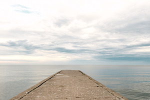 Empty concrete pier to the sea, a Nature Photo by BOOCYS