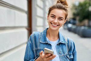 Friendly young woman use smartphone, a Person Photo by MistyDay