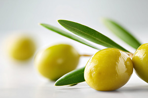 Close up of green olives with leaves, a Food & Drink Photo by MistyDay