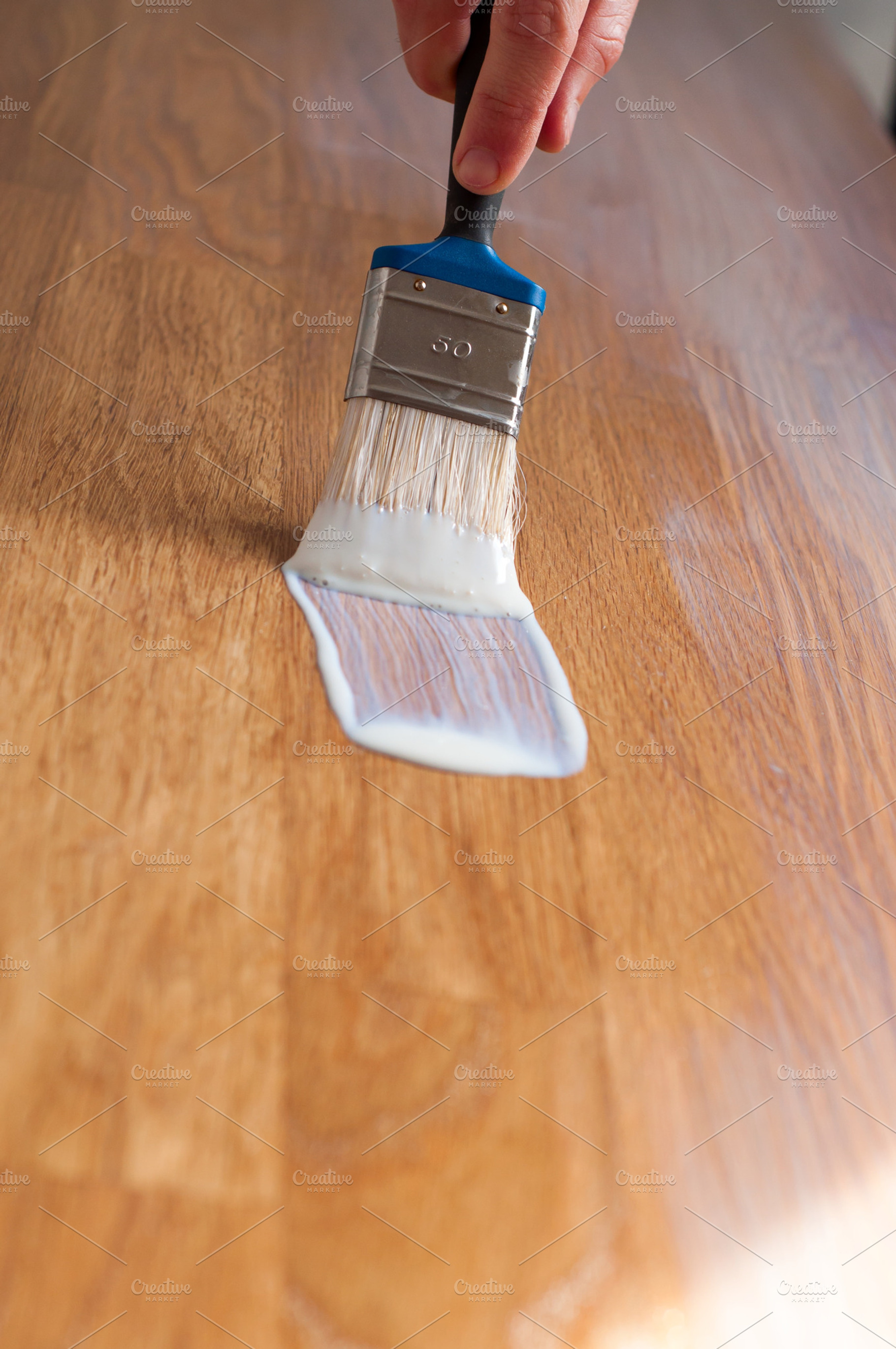 Process of varnishing a wooden surfa stock photo containing paint and painting