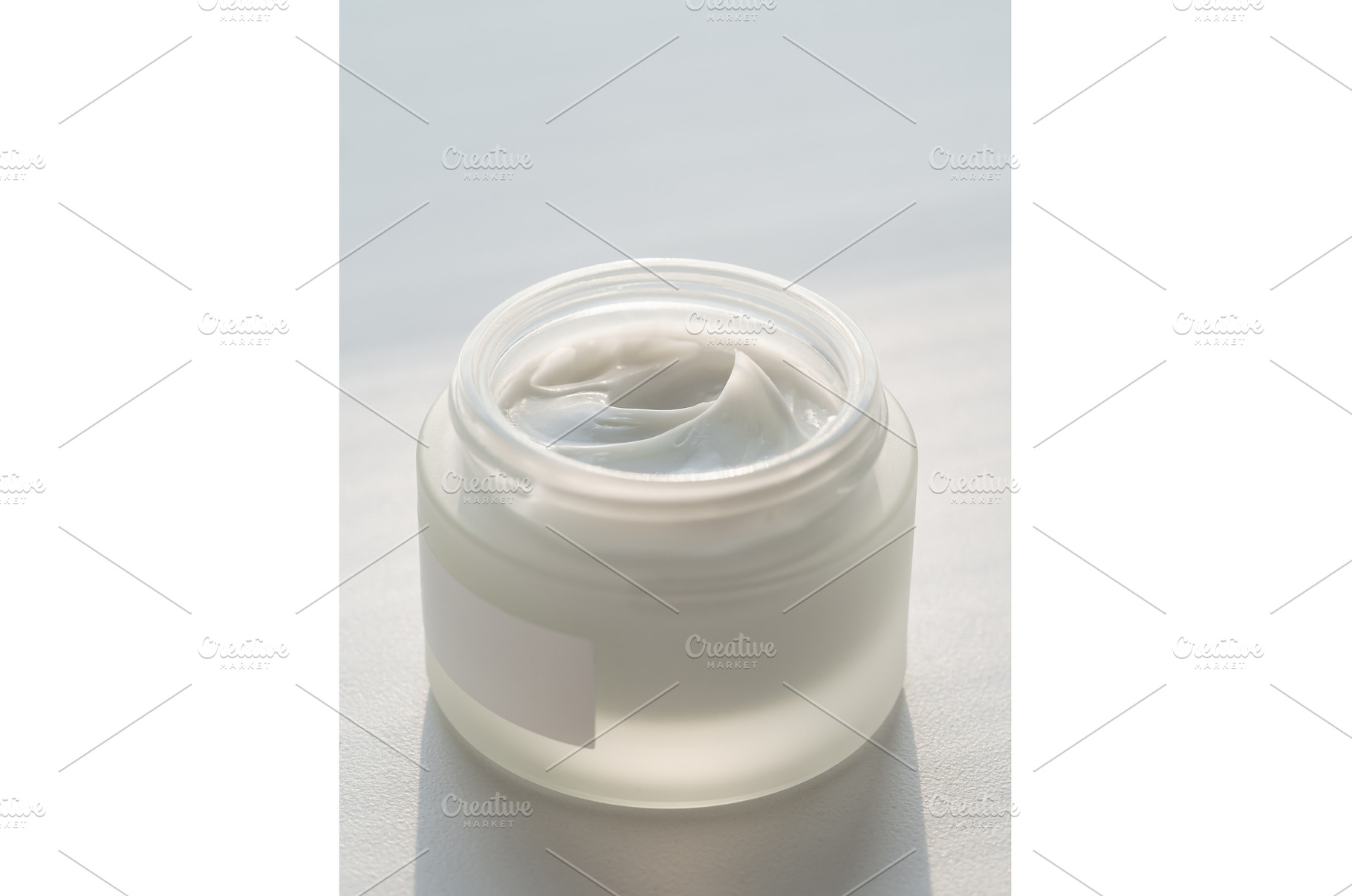 Open glasss jar with cosmetic cream, a Beauty & Fashion Photo by Fascinadora
