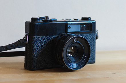 Vintage camera on a wooden table, a Technology Photo by OSORIOartist