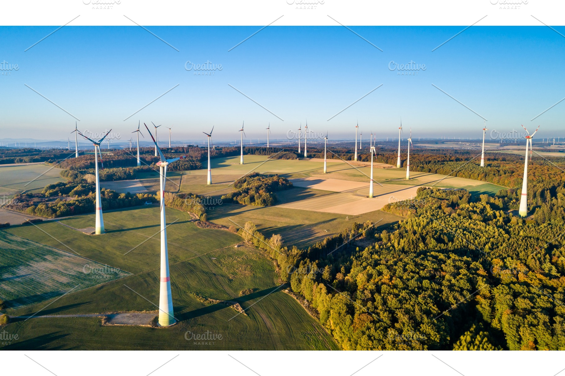 Aerial view of a wind farm in stock photo containing wind and turbine, an Industrial Photo by Leonid Andronov