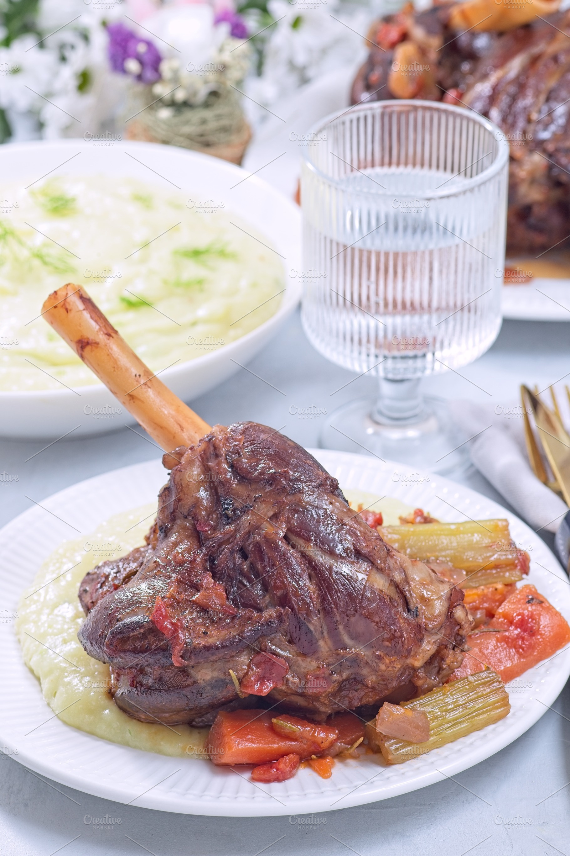 Braised lamb shanks with vegetables served with horseradish and fennel mashed p, a Food & Drink Photo by iuliia_n