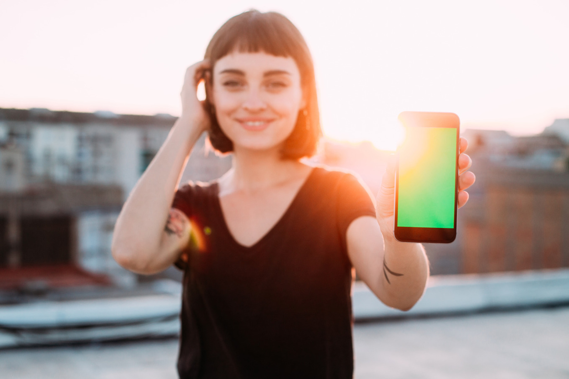 Young woman smiles with phone containing background, woman, and technology, a Technology Photo by DeRepente