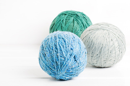 Balls of wool featuring thread, gray, and woven