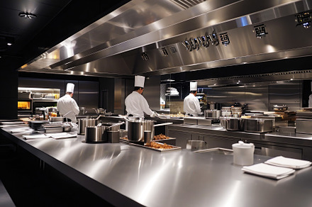 Two chefs working together in a comm, a Photo by Iftikhar Alam