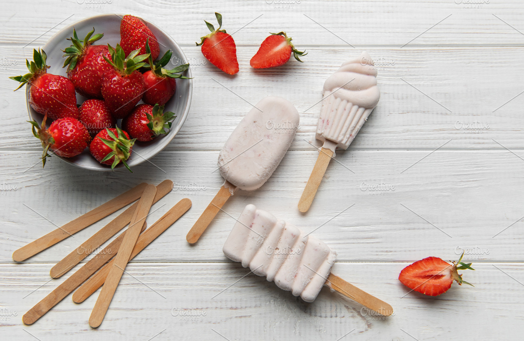 Homemade strawberry ice cream popsicles with fresh fruit, a Food & Drink Photo by Olena Rudo