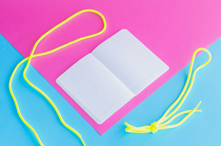 The school notebook lies on a bright background with empty pages, a School & Education Photo by Katya Havok