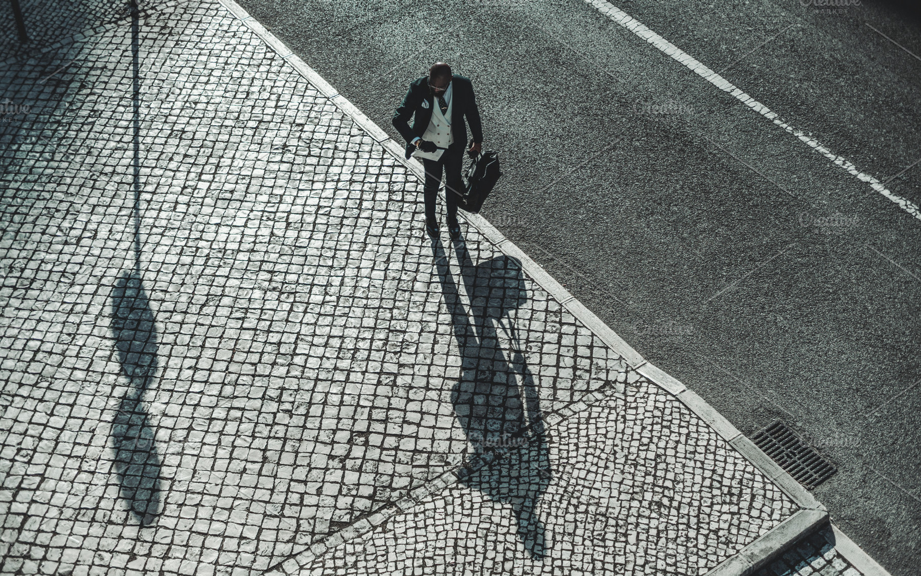 African man on the the sidewalk, a Person Photo by SkyNext