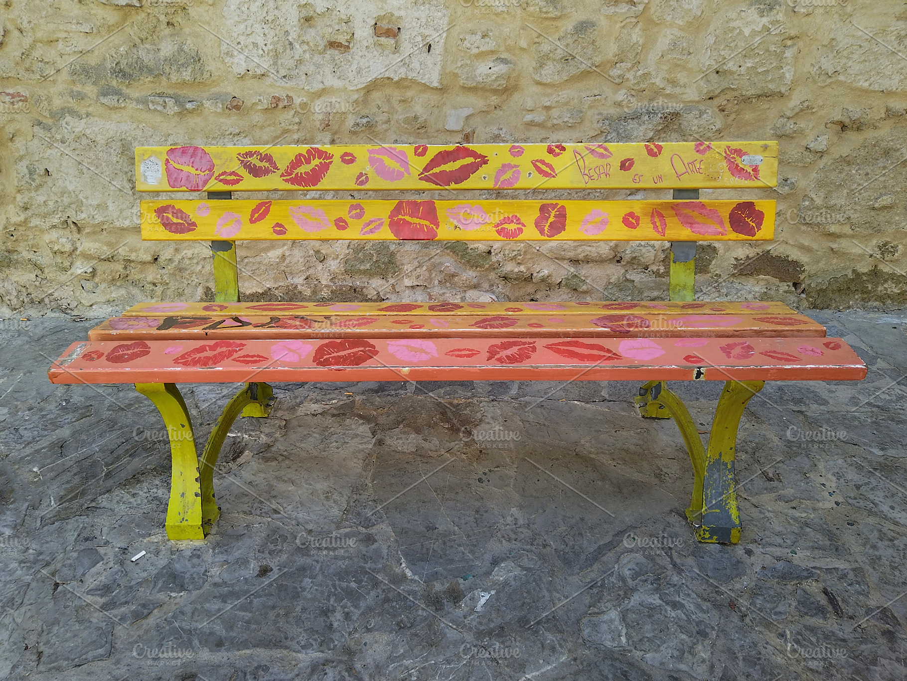 Colorful artistic bench in front of stone wall, an Arts & Entertainment Photo by DanFLCreativo