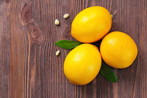 Fresh lemons on the table featuring lemon, orange, and mint