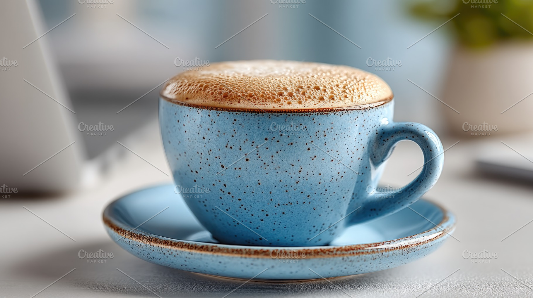 Close Up of Frothy Coffee in Blue Ceramic Cup on Desk with Soft, a Food & Drink Photo by José Manuel Gelpi