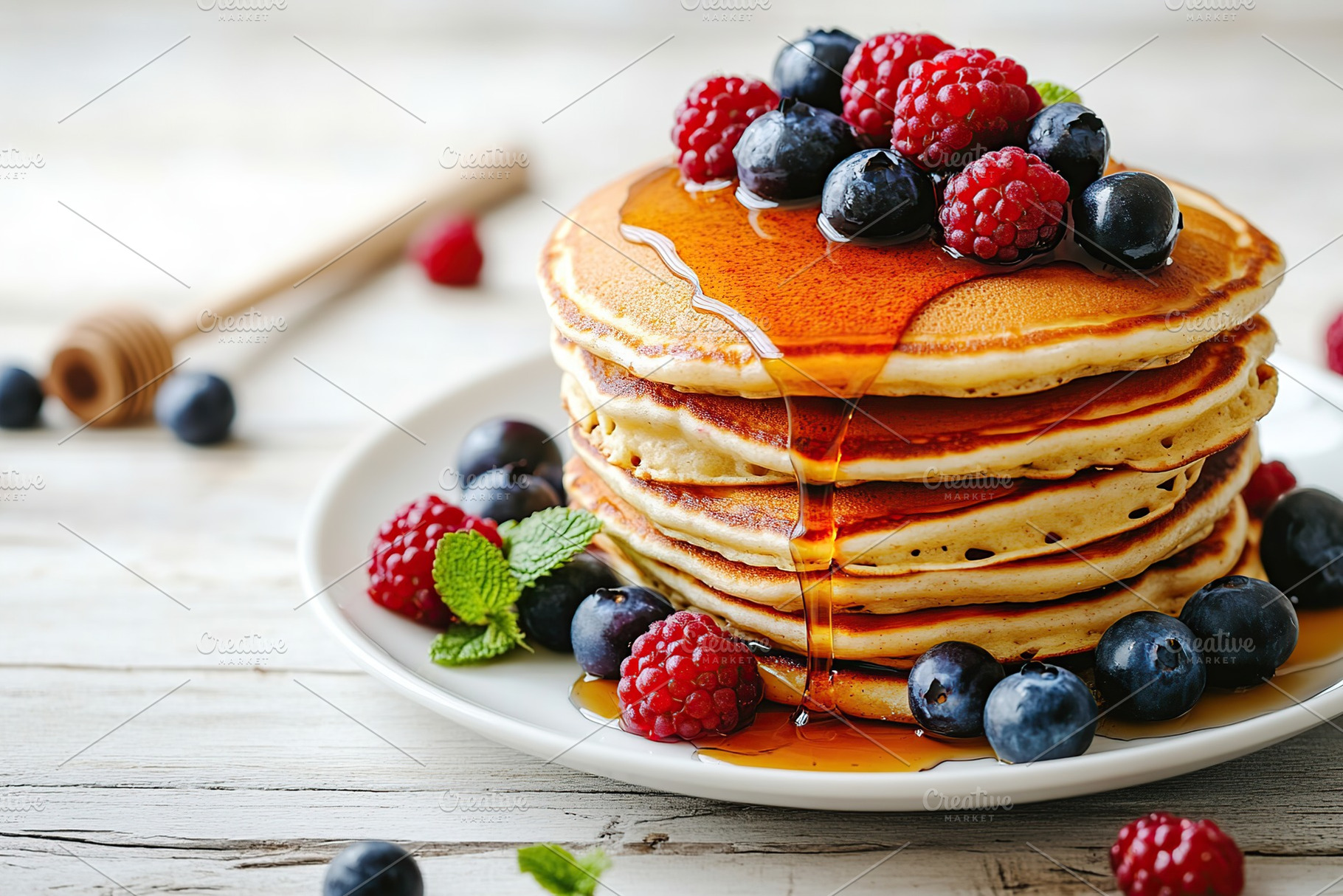 Delicious stack of fluffy pancakes topped with fresh berries and syrup, a Food & Drink Photo by AlyaAnd