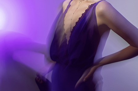 portrait of a brunette woman in a purple dress on white background in the studi, a Person Photo by SaulichPhoto