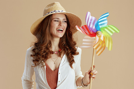 smiling stylish woman in blouse and shorts isolated on beige, a Person Photo by Alliance Images