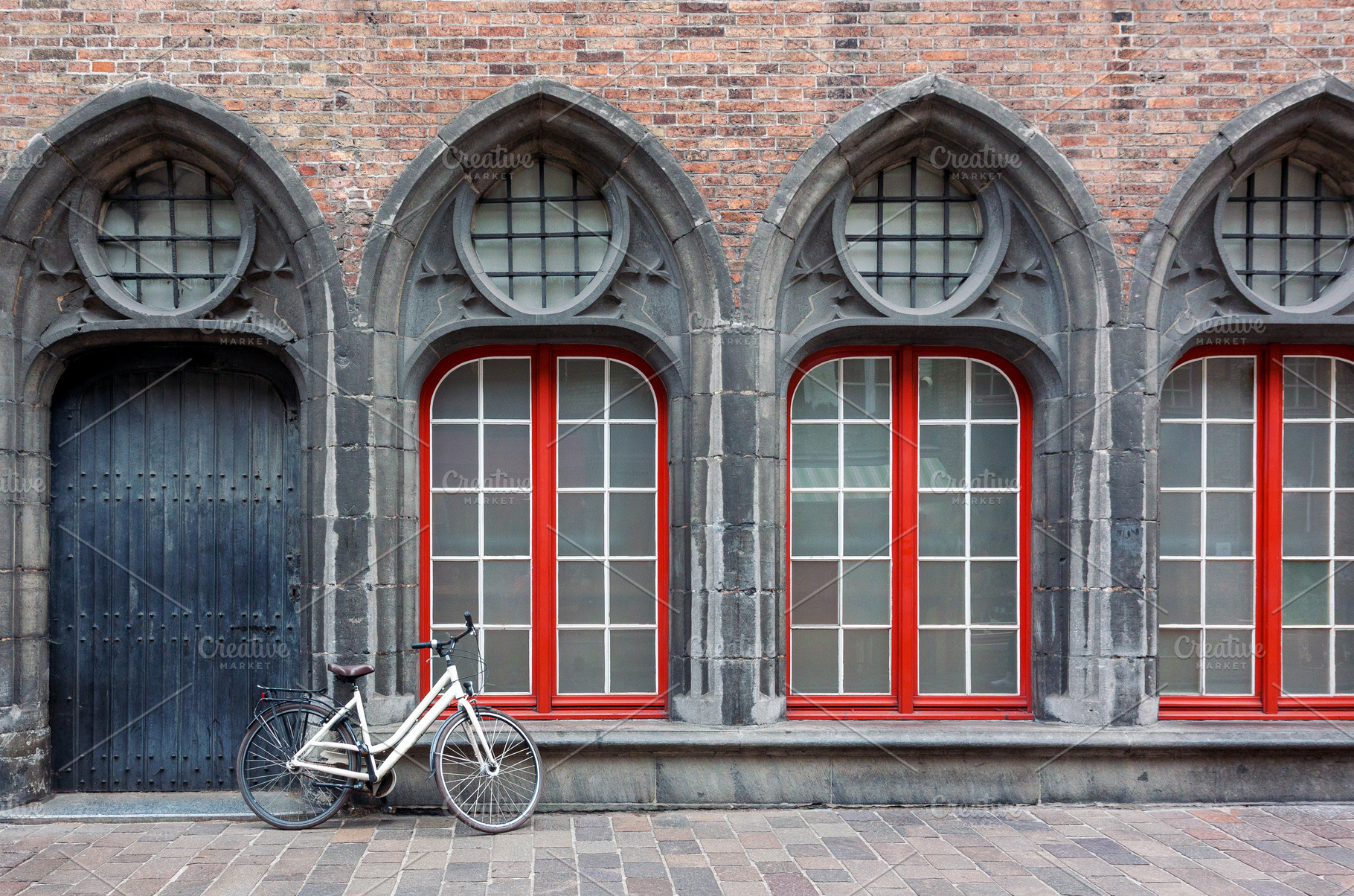 Lonely bicycle against old building, an Architecture Photo by BOOCYS