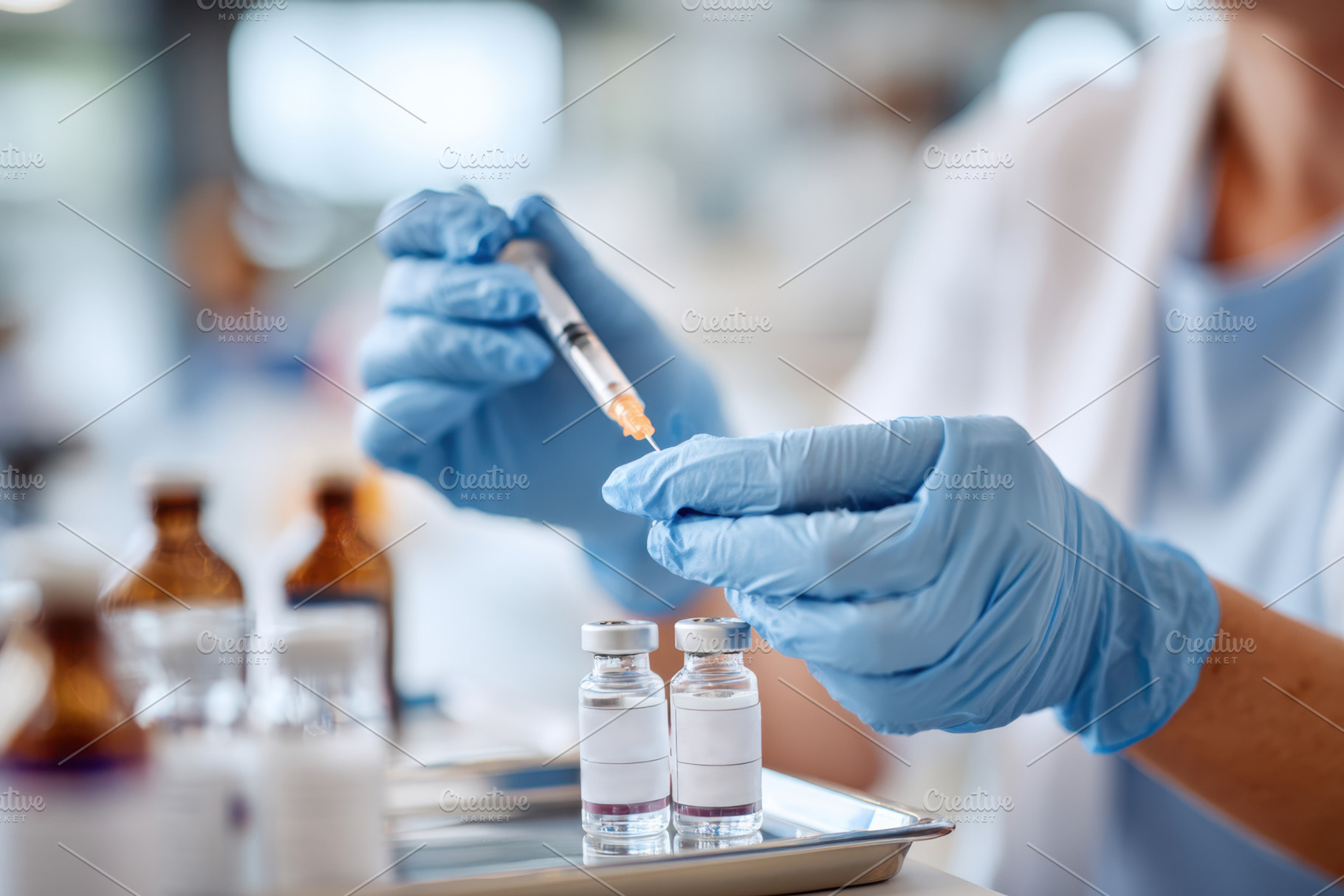 Healthcare professional preparing vaccine with syringe, a Health & Medical Photo by AlyaAnd