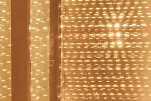 Closed curtains of apartment living room iluminated by the sun o, a Background Photo by DanFLCreativo