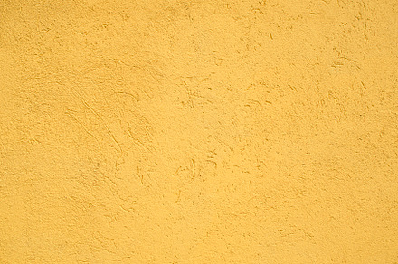 Texture of yellow stucco wall, a Photo by Psychopicture