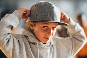 Young boy in cap and hoodie, a Person Photo by AlyaAnd