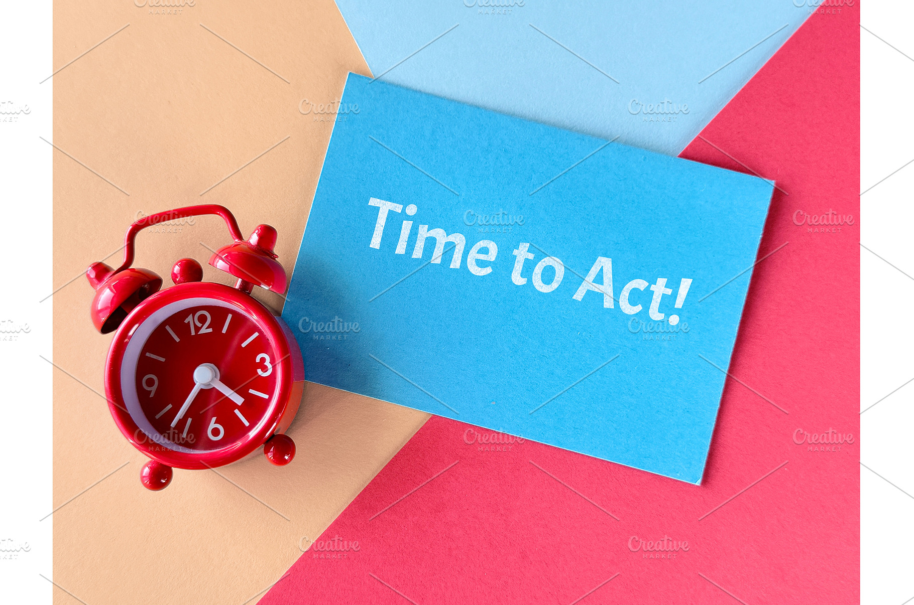 Red alarm clock and blue card with, a Photo by tilialucida
