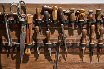 Closeup view at instruments for containing leather, hand, and sewing
