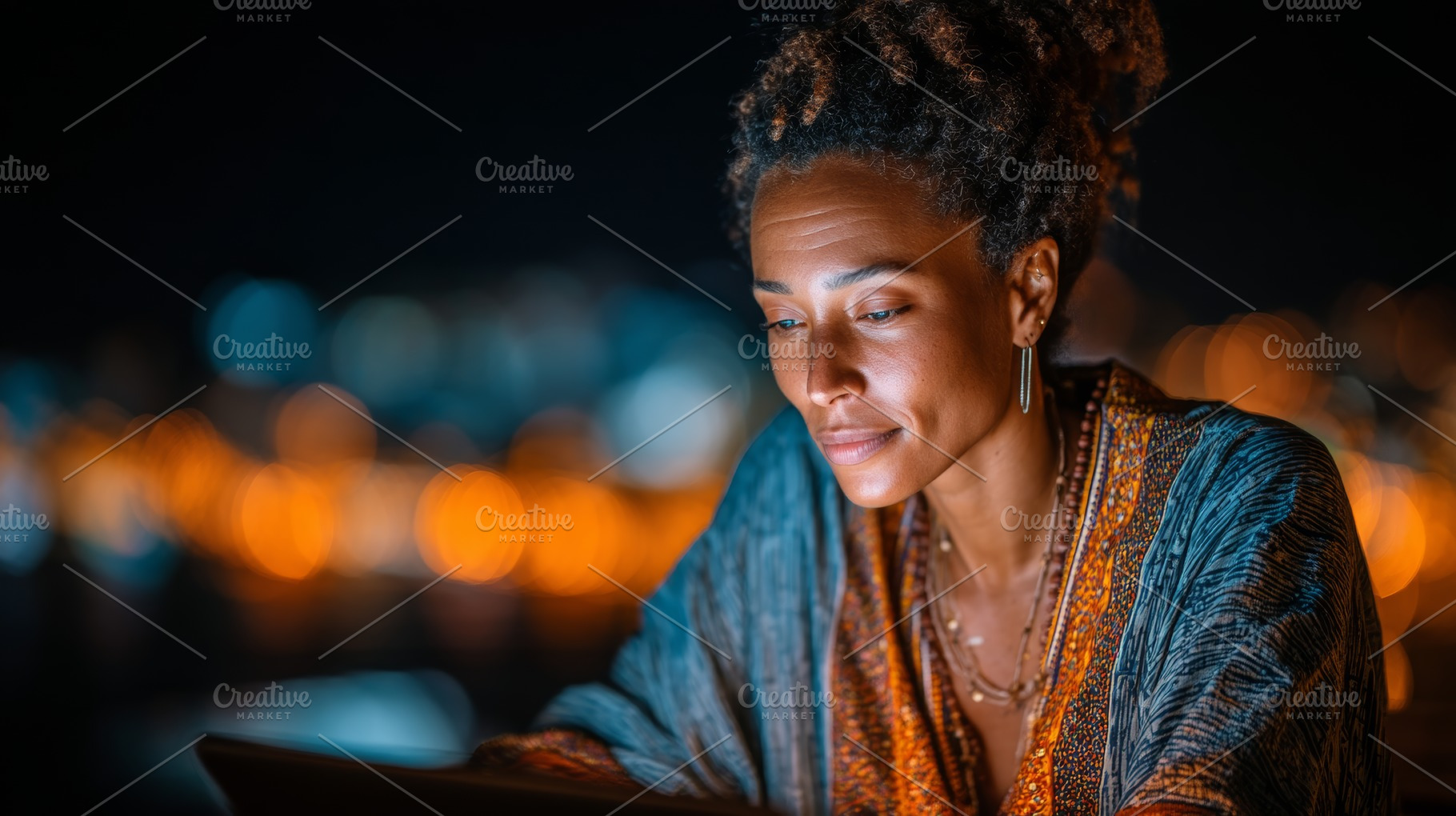 Black woman working on a tablet with city lights in the background at night, a Person Photo by AS photostudio