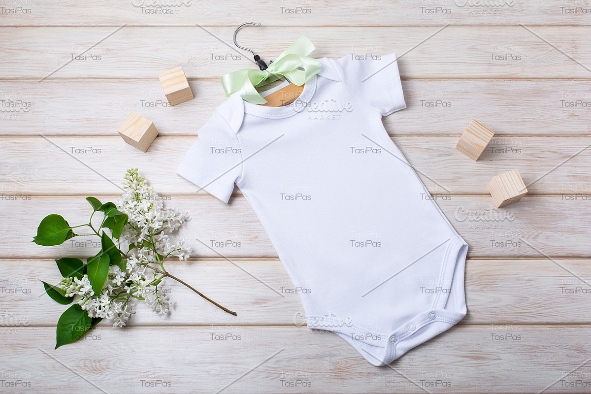 Baby onesie mockup with white lilac., a Shirt Mockup by TasiPas (Photo 3 of 4)