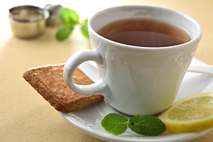Detail of white ceramic teacup and plate with ingredients, a Food & Drink Photo by Davizro's Market