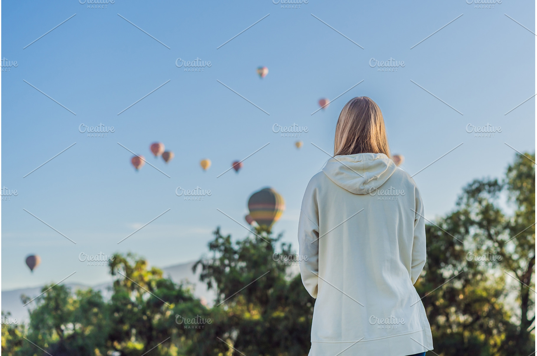 Female tourist standing with, a Holiday Photo by Elizaveta Galitskaya