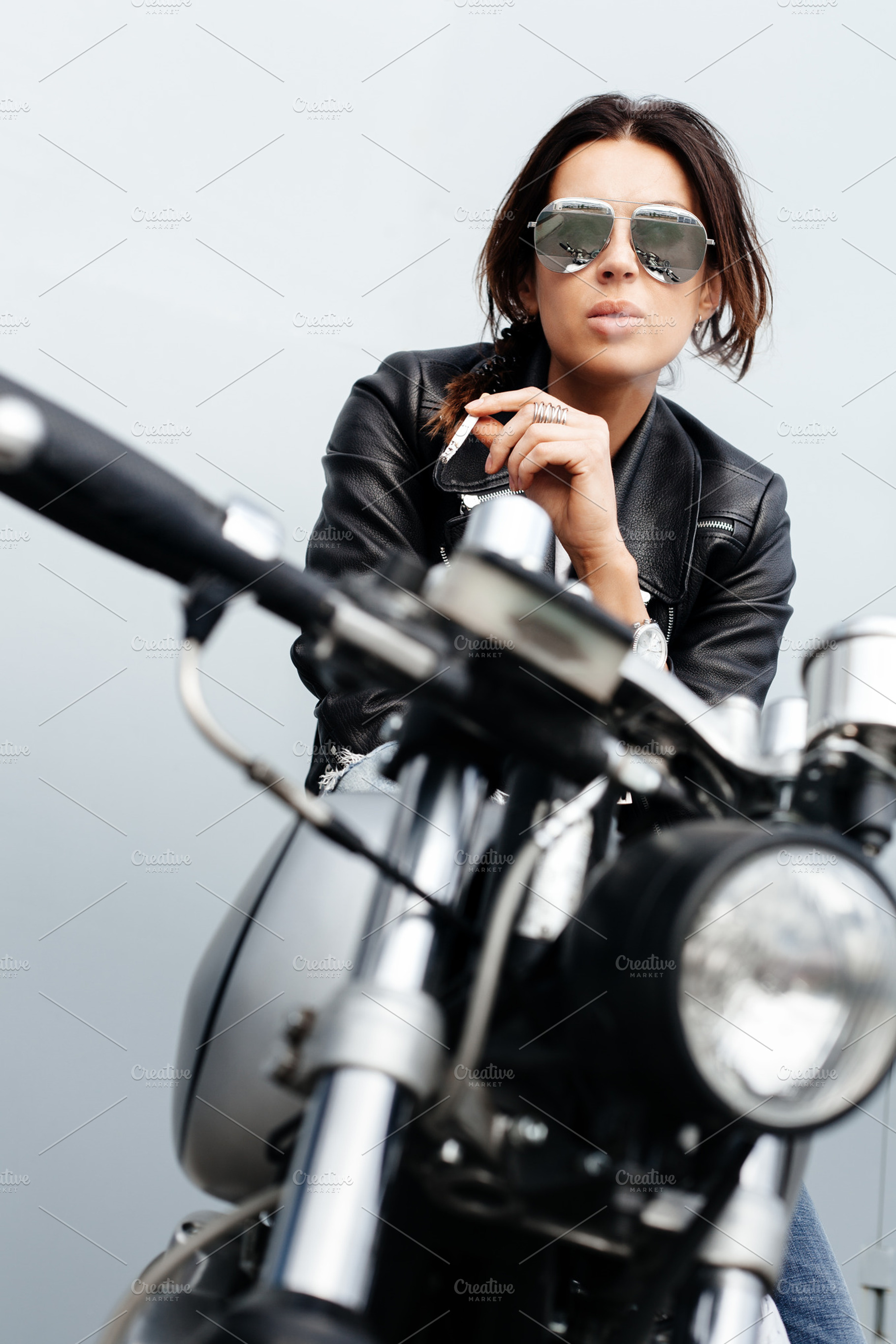 Biker woman in leather jacket on motorcycle containing girl, recast, and, a Person Photo by Aliaksei Kaponia