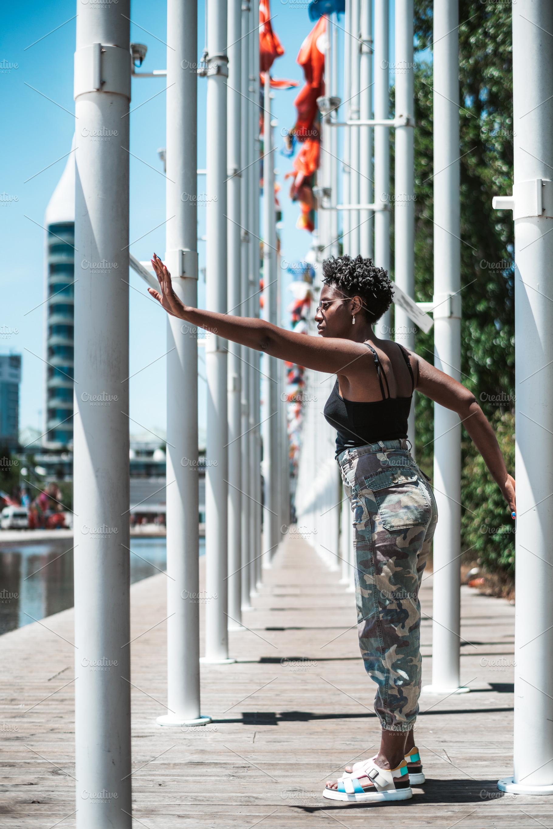 Dancer Between Flagpoles, a Person Photo by SkyNext