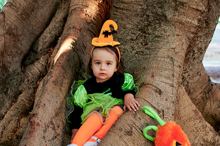 Baby in halloween costume outdoors