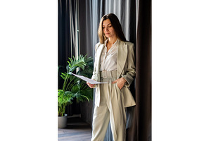 Young businesswoman with long brown, a Business Photo by undrey