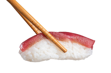 Tuna sushi nigiri in chopsticks, a Food & Drink Photo by Miguel Guasch