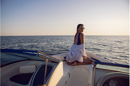 young sexy woman in a blue swimsuit, a Person Photo by SaulichPhoto