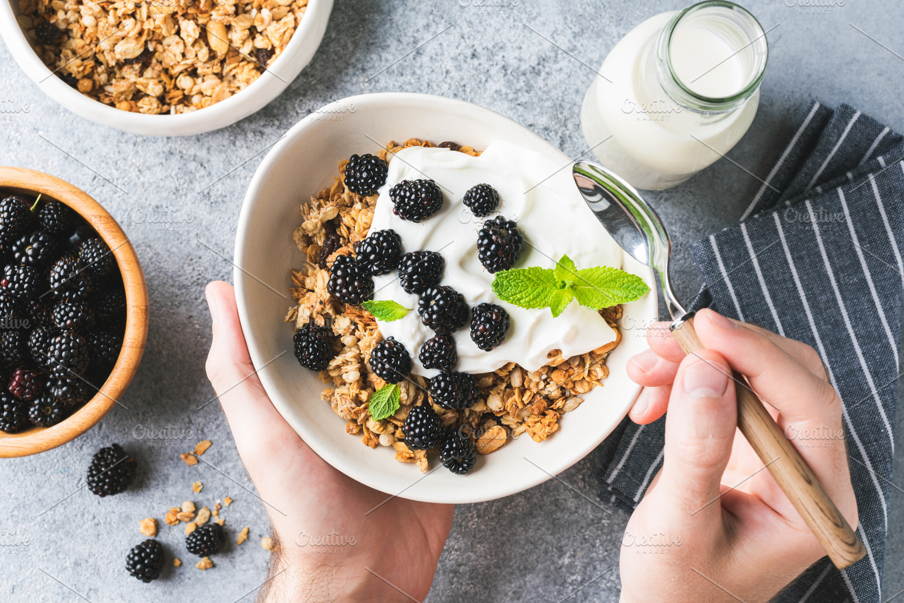 Bowl of granola with yogurt, berries, a Food & Drink Photo by The baking man