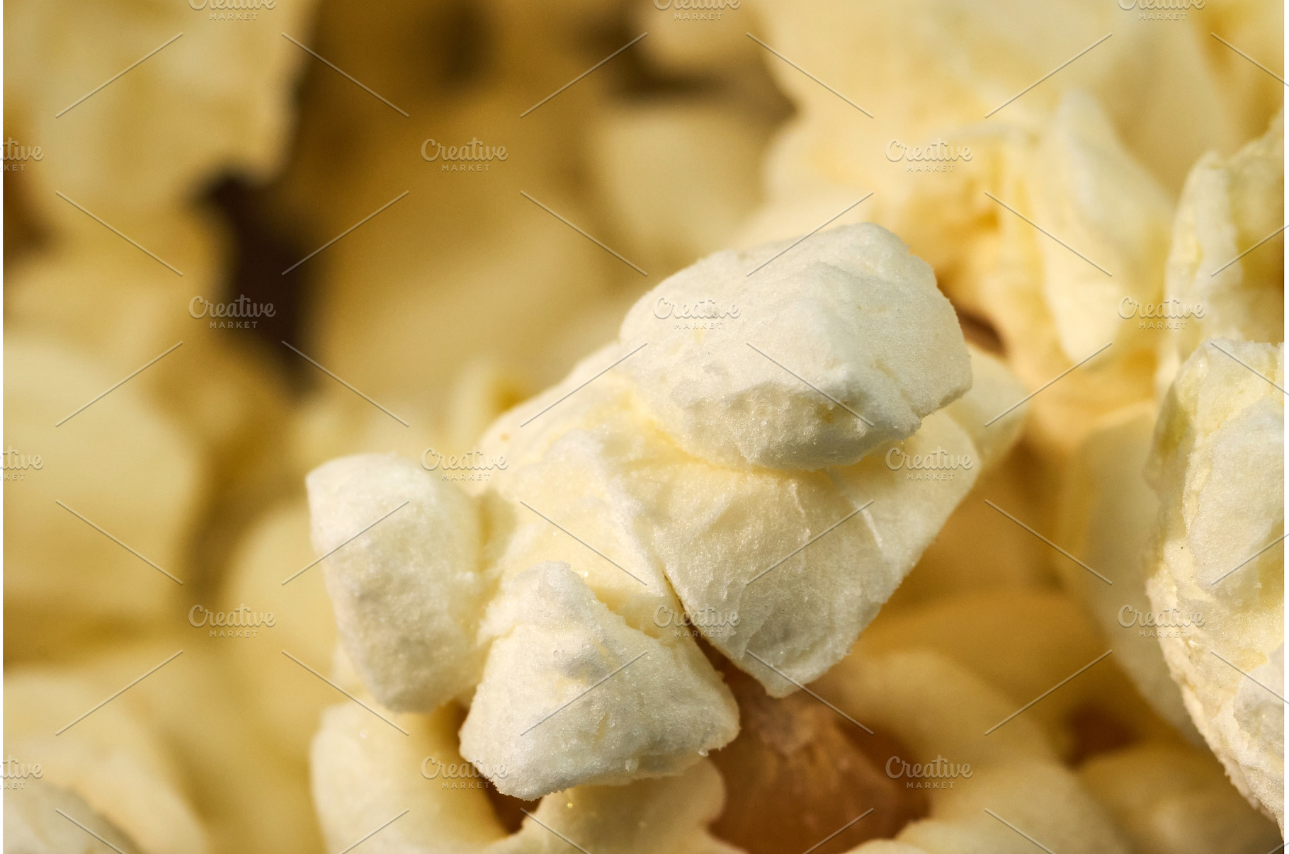 Fluffy white popcorn pieces fill a, a Background Photo by darksoul72