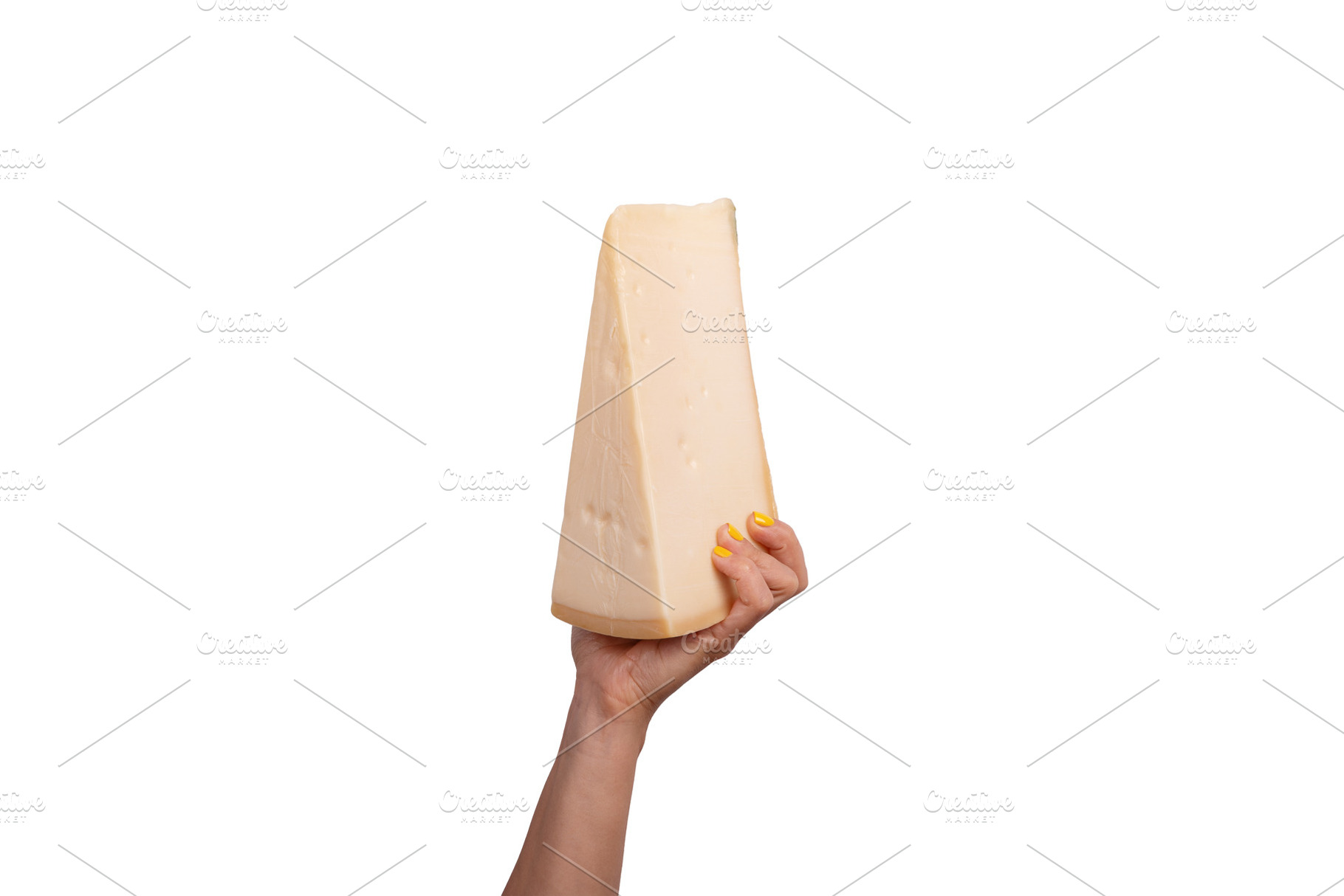 Large wedge of cheese held in a female hand with yellow nails, i, a Food & Drink Photo by Ales Munt