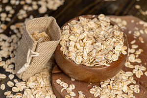 scattered dry cereal flakes from oats, flattened, steamed and dried, a Photo by rsoollAI