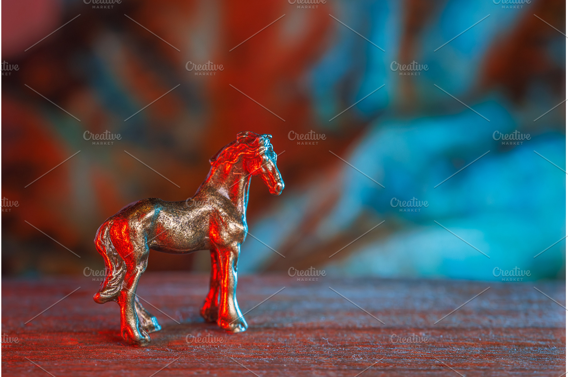 A metal horse figure with red tones, a Holiday Photo by Lukas Jonaitis SHOP