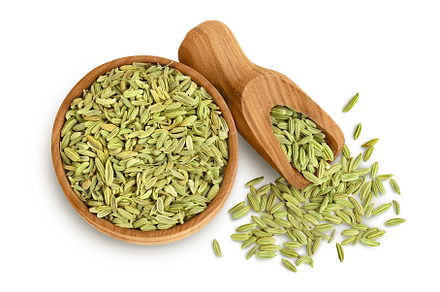 Dried fennel seeds in wooden bowl, a Food & Drink Photo by NataPhoto