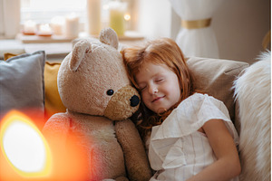 Small girl hugging teddy bear, a Person Photo by HalfPoint