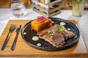Delicious grilled pork with potato gratin, a Photo by Grafvision photography