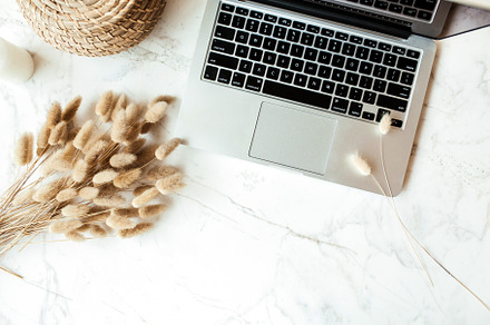 Flatlay workspace with laptop, a Business Photo by Floral Deco