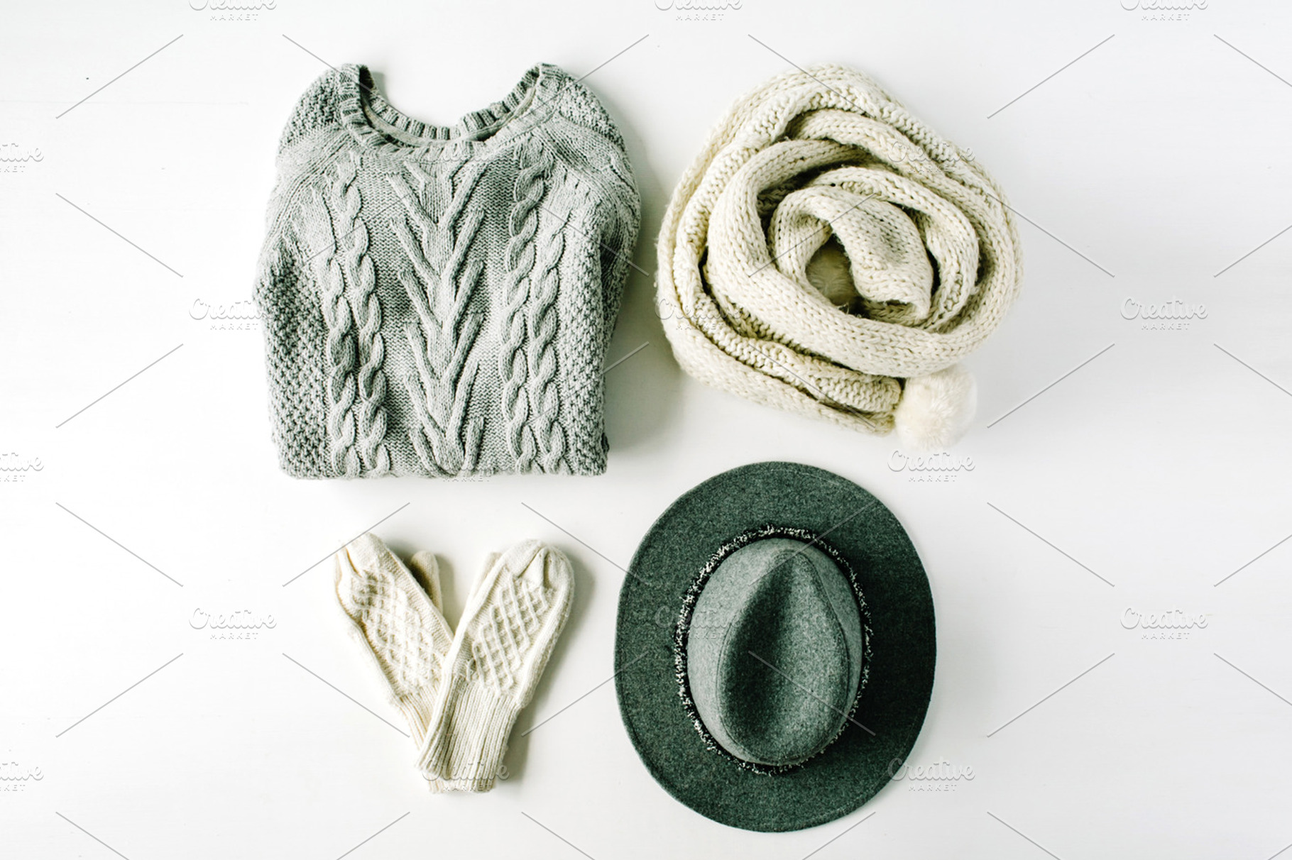 Winter clothes containing mittens, sweater, and scarf, a Beauty & Fashion Photo by Floral Deco